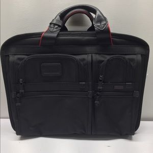 Tumi black canvas laptop case